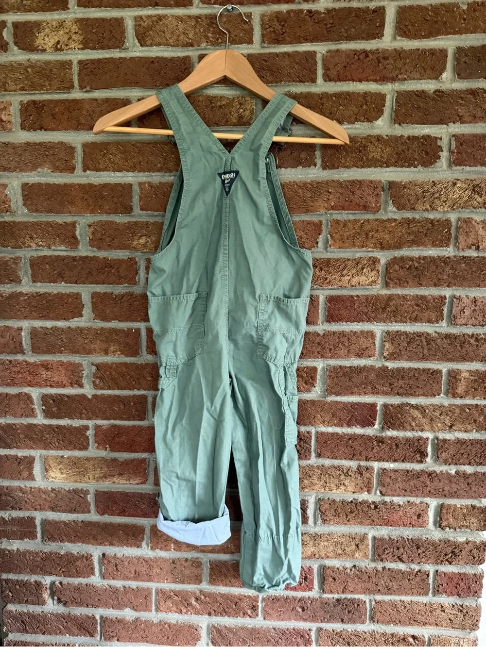 OshKosh B'gosh Kids Green Overalls. Airplanes on inside.  5T size.